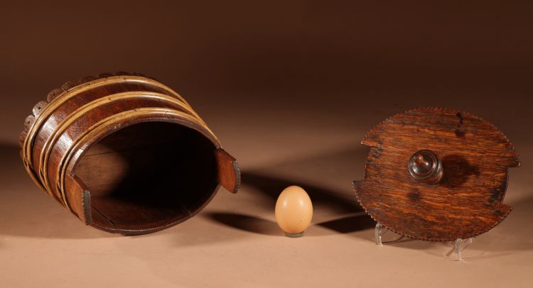 An oval oak butter pot.