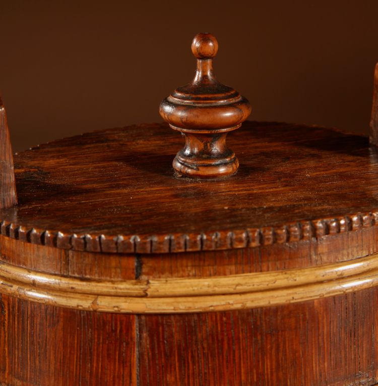 An oval oak butter pot.