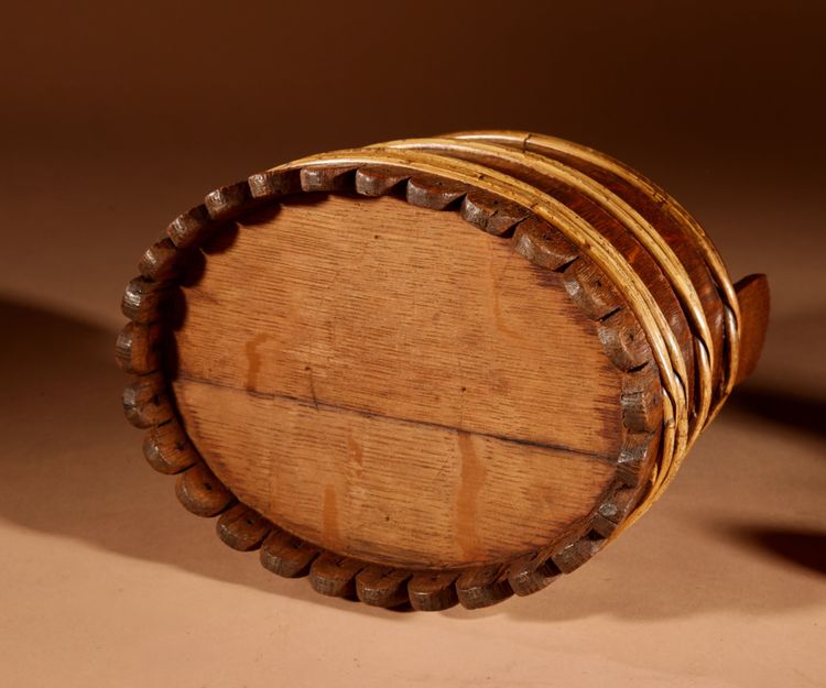 An oval oak butter pot.