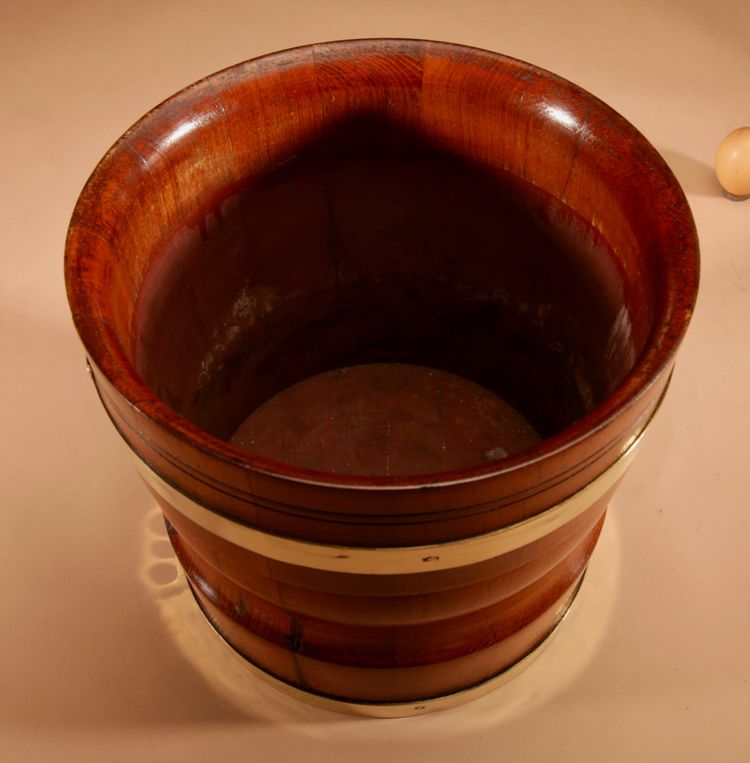 A large Dutch brass and turned teak planter/wine cooler, circa 1900