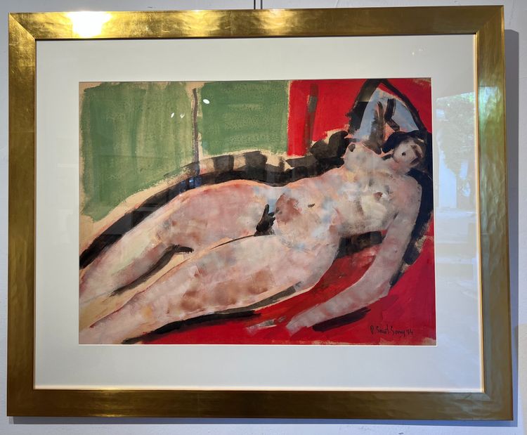 Nudo sdraiato su lenzuola rosse.