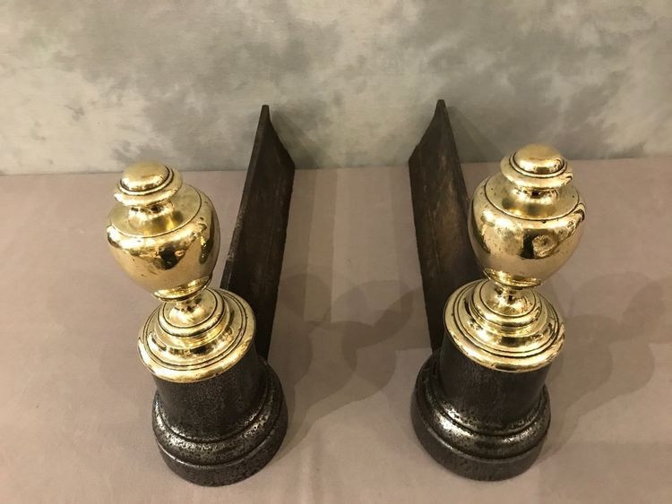 Pair of antique cast iron and brass andirons from the 19th century
