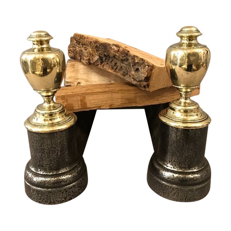 Pair of antique cast iron and brass andirons from the 19th century