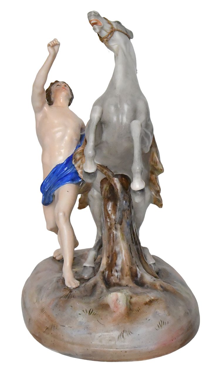 Groupe en porcelaine représentant un homme avec un cheval cabré 