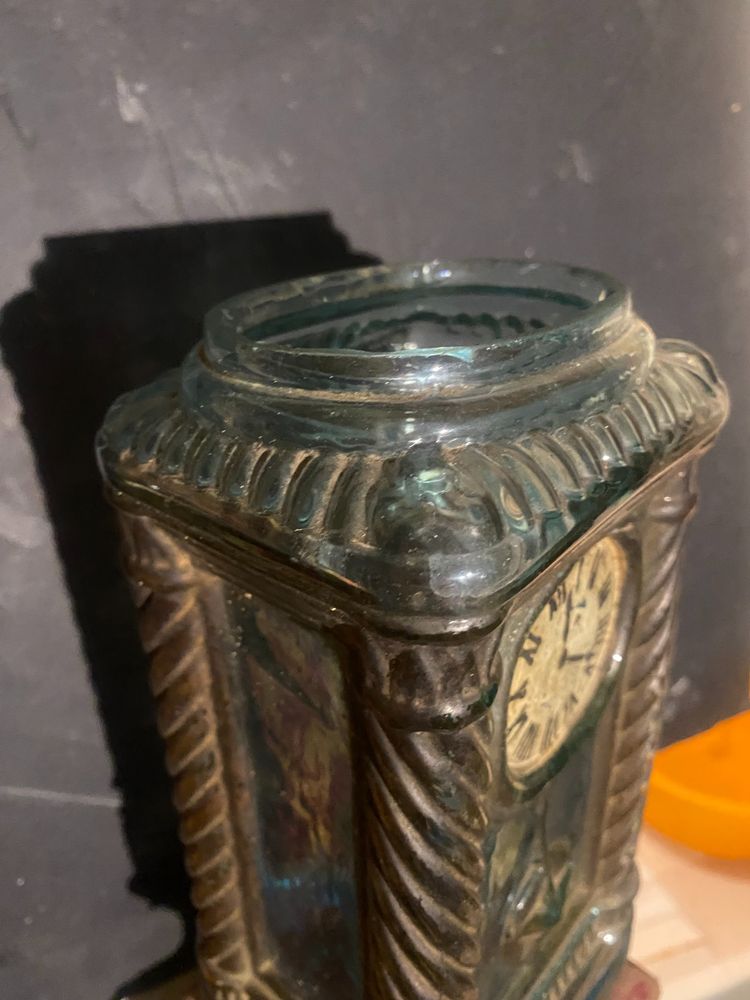 Rare molded glass bottle in imitation of a clock enhanced with painting, Napoleon III period