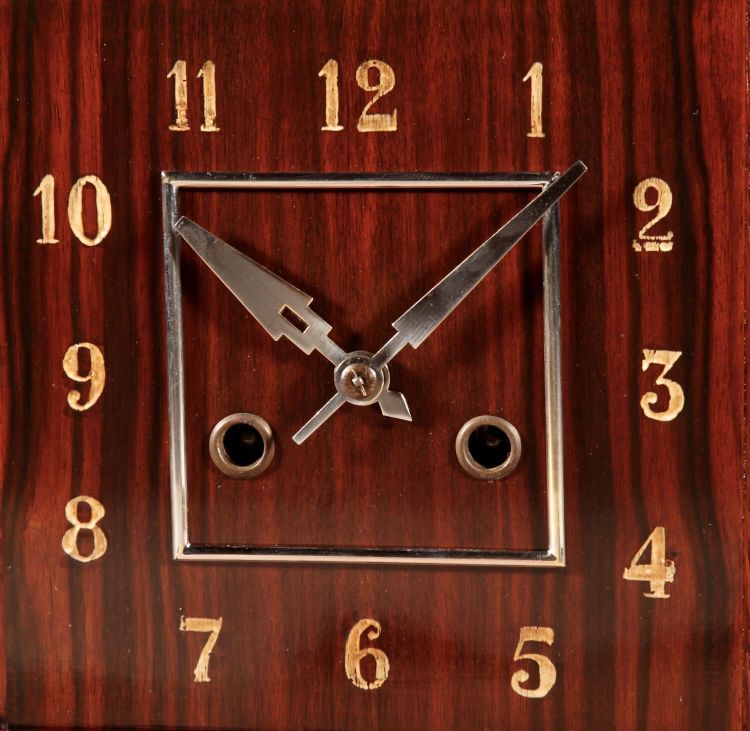  A very elegant mantel clock typical of the Amsterdam Art Deco school in oak and ebony from
