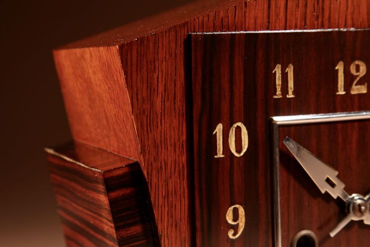  A very elegant mantel clock typical of the Amsterdam Art Deco school in oak and ebony from