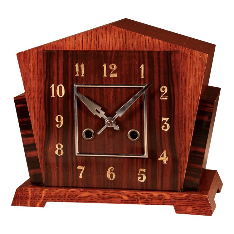  A very elegant mantel clock typical of the Amsterdam Art Deco school in oak and ebony from
