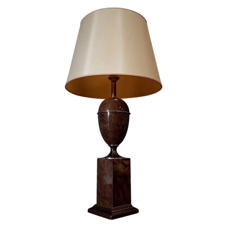 Marble-effect lamp with 1980 shade on shower base
